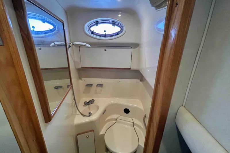 Slide: The Image of Bathroom interior of 1997 Sea Ray 450 Sundancer yacht with shower and toilet. - 18