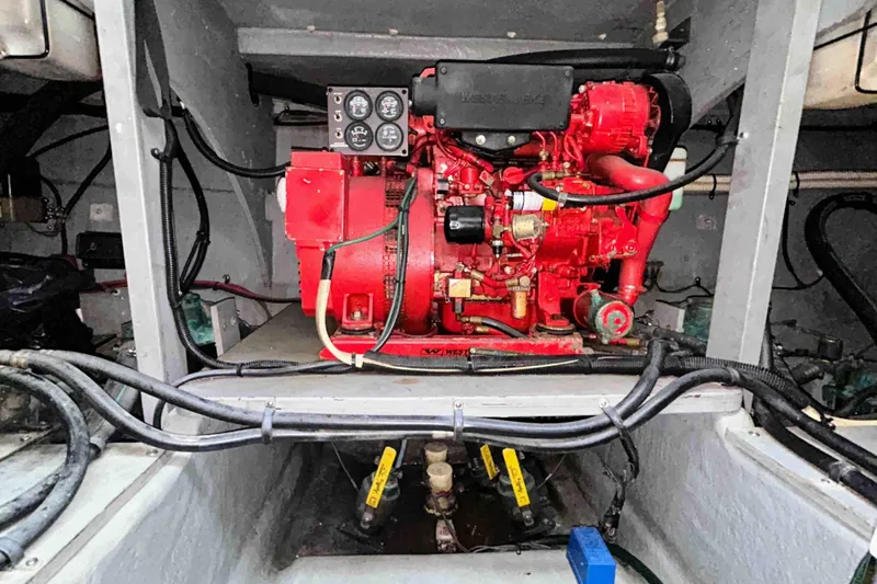 Slide: The Image of Engine compartment of a 1997 Sea Ray 450 Sundancer with visible red machinery. - 22