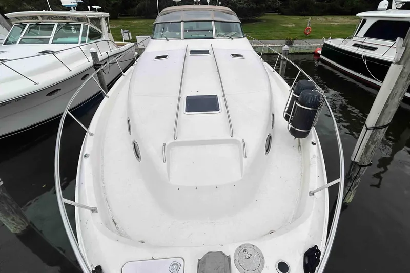 Slide: The Image of 1997 Sea Ray 450 Sundancer yacht docked at marina, top view. - 3