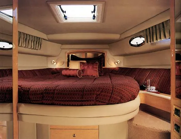 Slide: The Image of 1997 Sea Ray 450 Sundancer helm with leather seating and panoramic windows. - 6