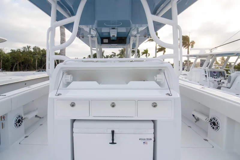 Slide: The Image of 2026 Invincible 38 Catamaran interior with storage and cooler, showcasing sleek design. - 18
