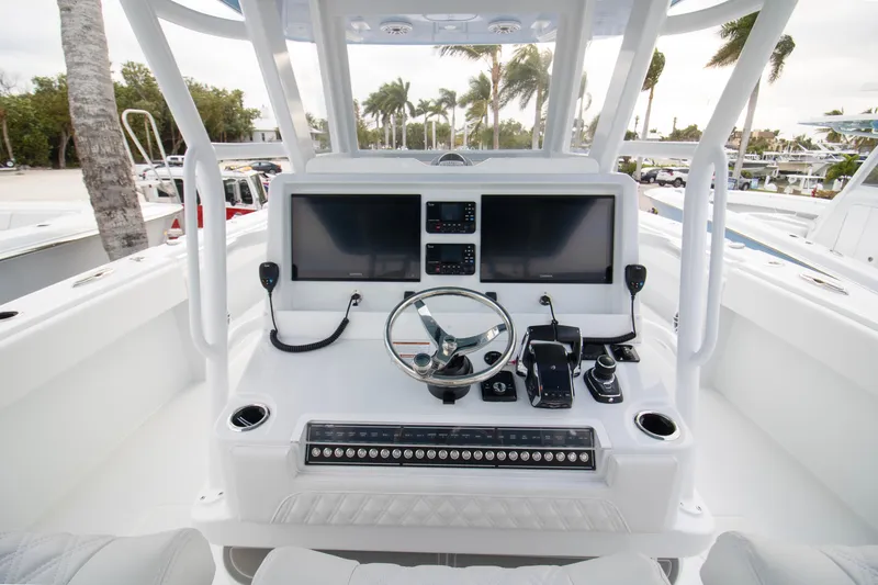 Slide: The Image of 2026 Invincible 38 Catamaran helm with dual screens and modern controls. - 2