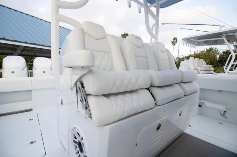 Slide: The Image of Luxurious seating on 2026 Invincible 38 Catamaran, featuring plush white upholstery and modern design. - 23