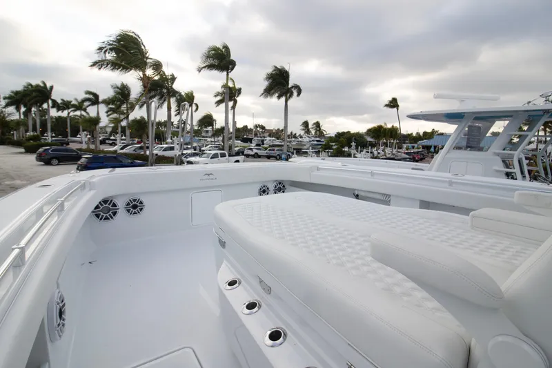 Slide: The Image of 2026 Invincible 38 Catamaran with sleek white deck and luxurious seating. - 3