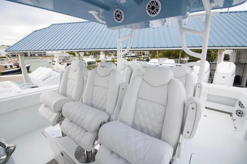 Slide: The Image of Luxurious seating on 2026 Invincible 38 Catamaran, featuring plush white upholstery and modern design. - 5