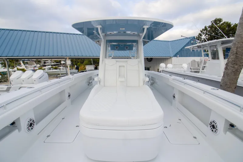 Slide: The Image of 2026 Invincible 38 Catamaran with sleek white deck and modern seating. - 8