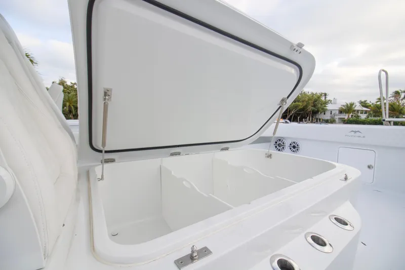 Slide: The Image of Open storage compartment on 2026 Invincible 38 Catamaran, showcasing spacious interior design. - 9