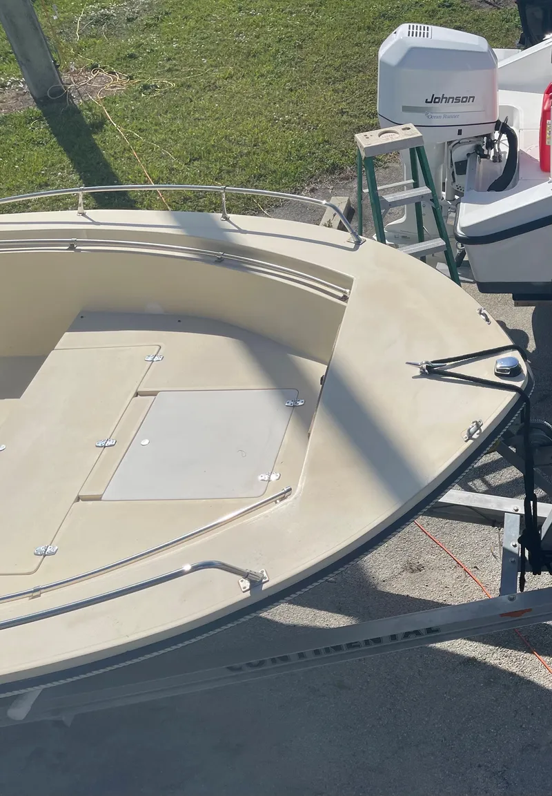 Slide: The Image of 1986 Gulf Stream Yachts custom boat with Johnson outboard motor on trailer. - 11