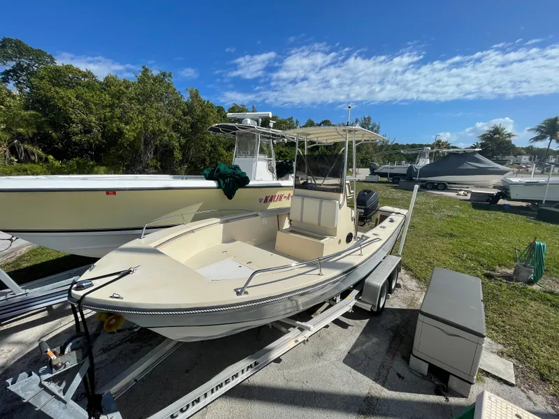Slide: The Image of 1986 Gulf Stream Yachts custom boat on trailer in a marina. - 2