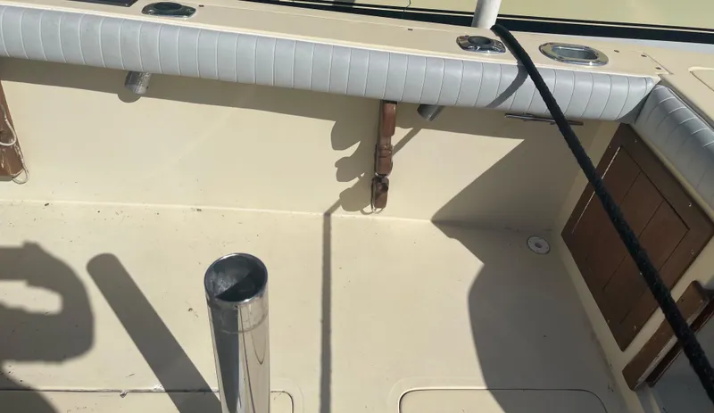 Slide: The Image of 1986 Gulf Stream Yachts custom boat deck with rod holders and storage compartments. - 22