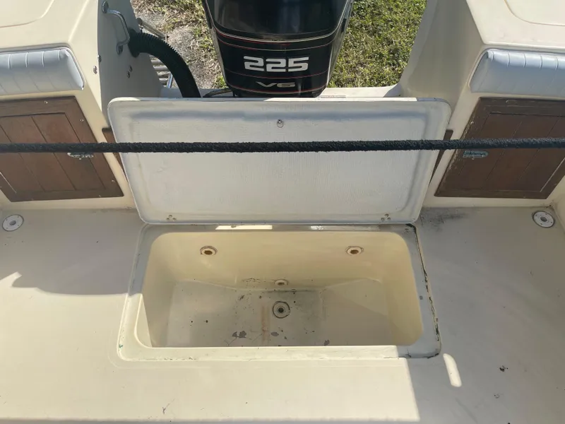 Slide: The Image of Open storage compartment on a 1986 Gulf Stream Yachts custom boat with a 225 HP engine. - 24
