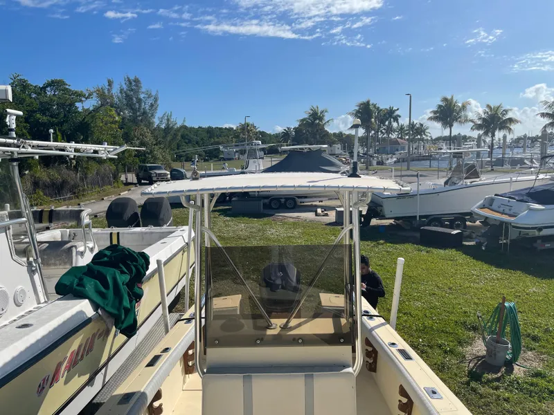 Slide: The Image of 1986 Gulf Stream Yachts custom boat docked at a marina under a clear blue sky. - 26