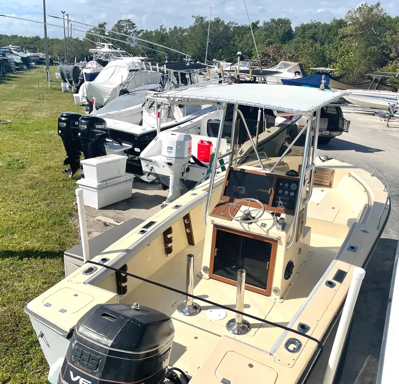 Slide: The Image of 1986 Gulf Stream Yachts custom boat in a marina, surrounded by other boats. - 27