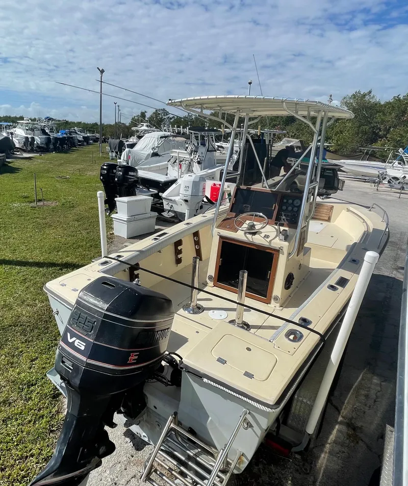 Slide: The Image of 1986 Gulf Stream Yachts custom boat with V6 engine, docked outdoors. - 33