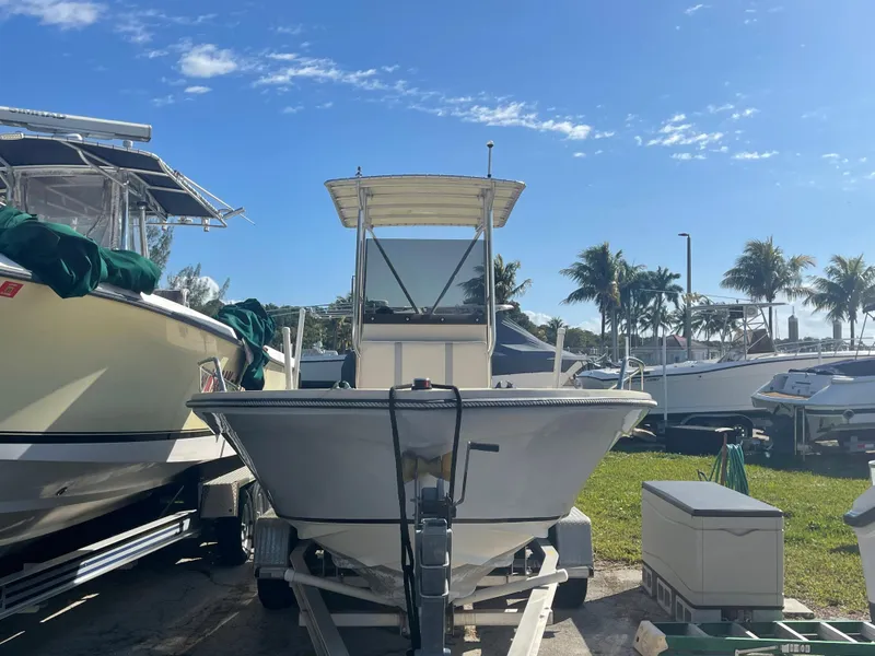 Slide: The Image of 1986 Gulf Stream Yachts custom boat on trailer, parked outdoors under clear sky. - 5