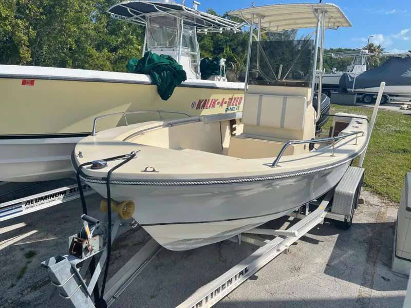 Slide: The Image of 1986 Gulf Stream Yachts custom boat on a trailer, parked outdoors. - 1