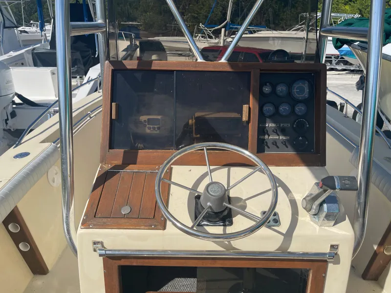 Slide: The Image of 1986 Gulf Stream Yachts custom boat helm with steering wheel and control panel. - 17