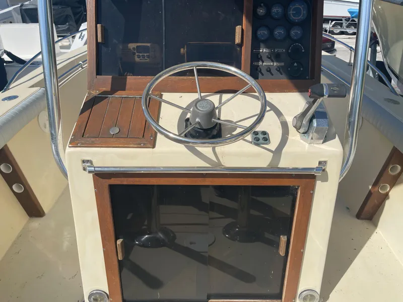 Slide: The Image of 1986 Gulf Stream Yachts custom boat helm with steering wheel and control panel. - 18