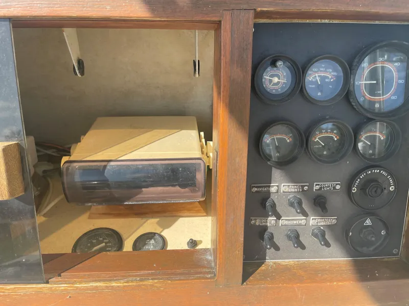 Slide: The Image of 1986 Gulf Stream Yachts custom dashboard with gauges and controls. - 19