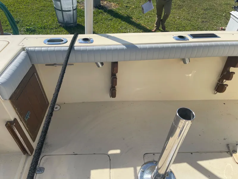 Slide: The Image of 1986 Gulf Stream Yachts custom boat interior with rod holders and padded seating. - 21