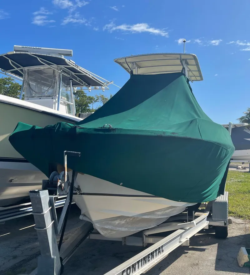 Slide: The Image of 1986 Gulf Stream Yachts custom boat with green cover on trailer. - 32