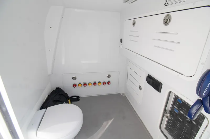 Slide: The Image of Invincible 36 Catamaran 2026 interior detail with speaker and hose storage. - 12