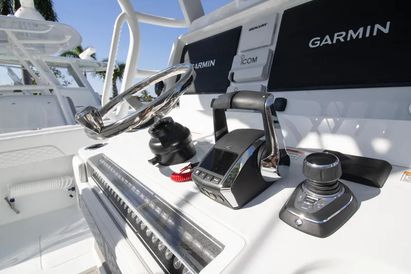 Slide: The Image of Helm of 2026 Invincible 36 Catamaran with Garmin navigation system and controls. - 18