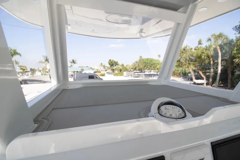 Slide: The Image of Control panel of 2026 Invincible 36 Catamaran with steering wheel and electronic controls. - 19