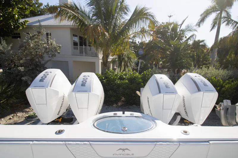 Slide: The Image of 2026 Invincible 36 Catamaran with sleek white seating and modern design features. - 26