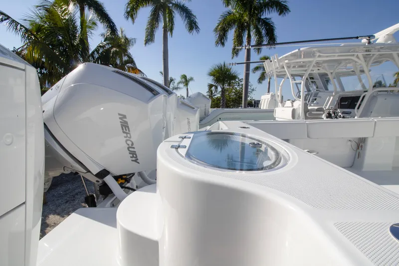 Slide: The Image of 2026 Invincible 36 Catamaran with quad Mercury engines, spacious deck, and sleek design. - 27