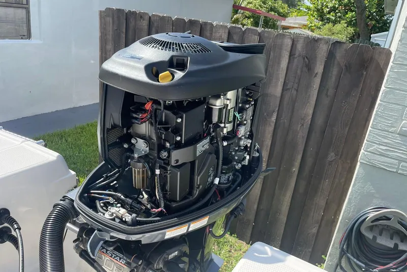 Slide: The Image of Open outboard motor of a 2016 Robalo R200 Center Console boat, showing internal components. - 7