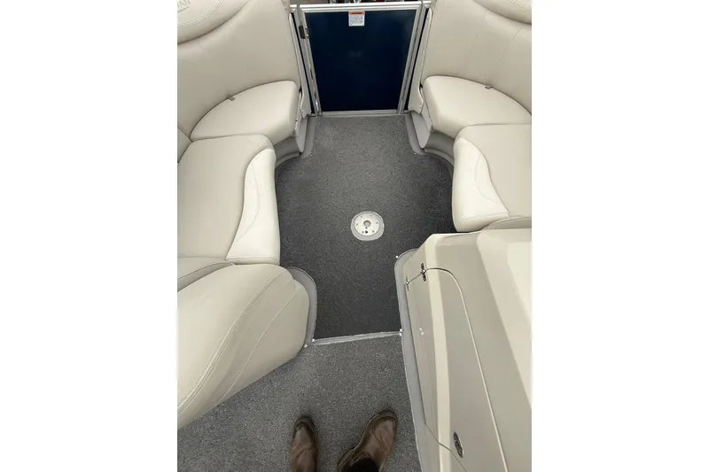 Slide: The Image of Interior of 2016 Sylvan Mirage Cruise 8522 LZ LE with beige seating and gray carpet. - 12