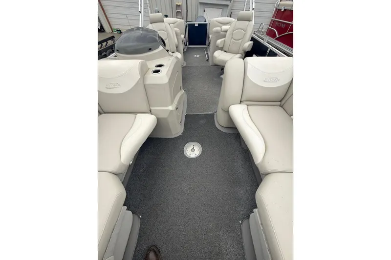 Slide: The Image of 2016 Sylvan Mirage Cruise 8522 LZ LE pontoon boat interior with beige seating. - 15