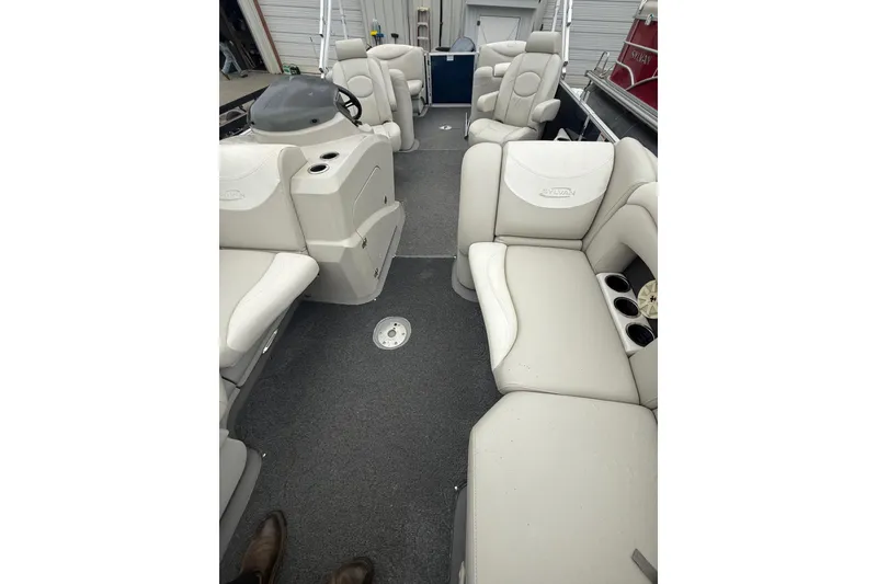 Slide: The Image of 2016 Sylvan Mirage Cruise 8522 LZ LE pontoon boat interior with plush seating and cup holders. - 16
