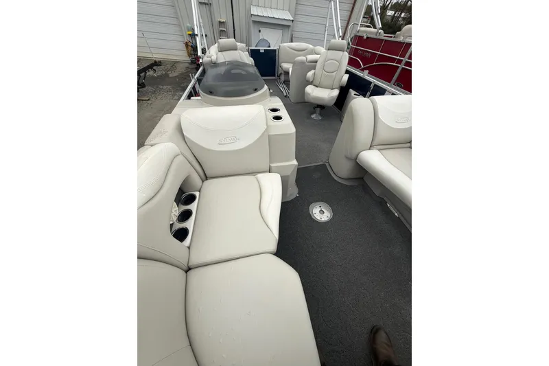 Slide: The Image of 2016 Sylvan Mirage Cruise 8522 LZ LE pontoon boat interior with plush seating. - 17