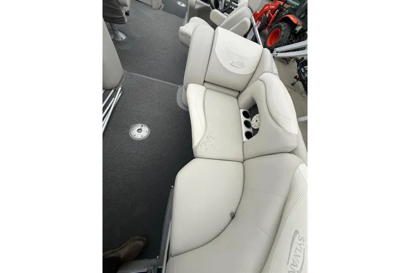 Slide: The Image of 2016 Sylvan Mirage Cruise 8522 LZ LE boat interior with plush seating and cup holders. - 6