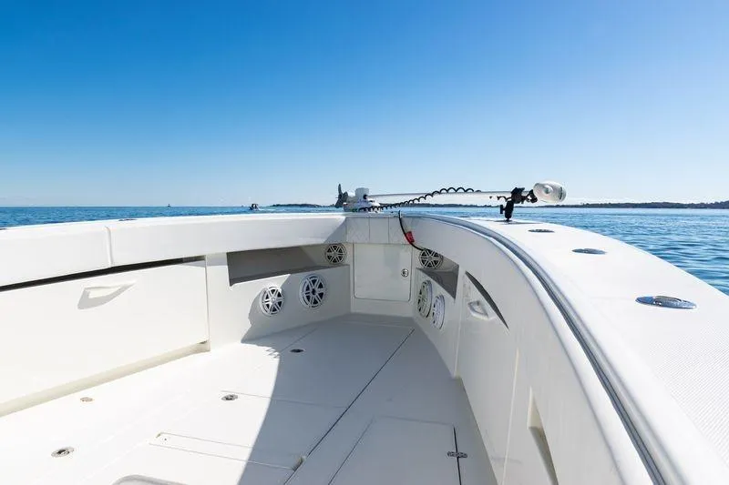 Slide: The Image of 2016 SeaVee 390Z boat deck with speakers, clear blue sky, and calm ocean. - 15