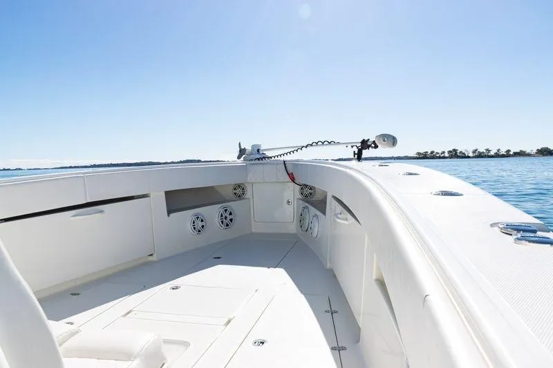 Slide: The Image of 2016 SeaVee 390Z boat deck with speakers, clear sky, and calm water. - 16