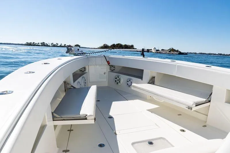 Slide: The Image of 2016 SeaVee 390Z boat interior with seating, on calm blue water. - 18