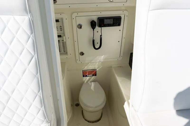 Slide: The Image of 2016 SeaVee 390Z boat interior with toilet and communication equipment. - 23