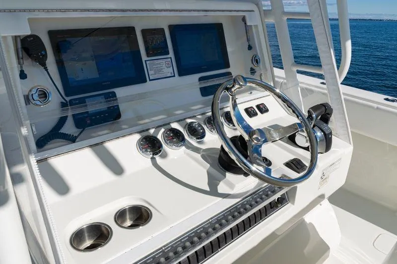 Slide: The Image of 2016 SeaVee 390Z boat helm with modern controls and ocean view. - 29