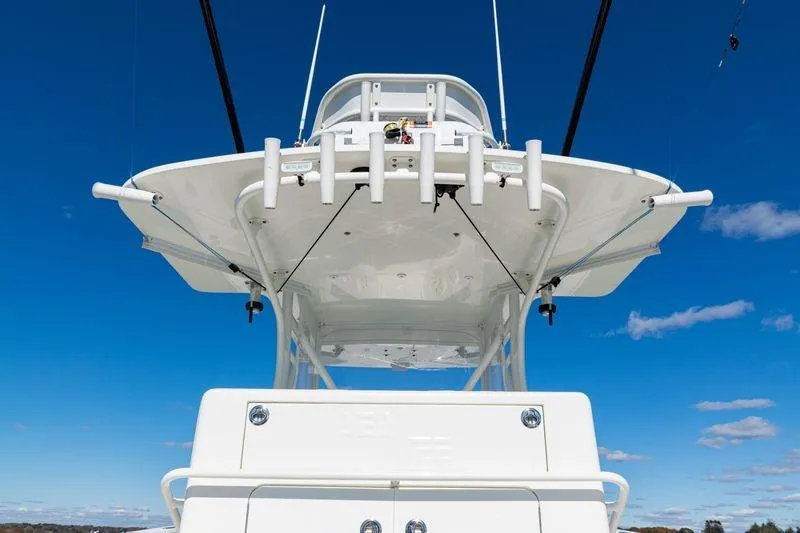 Slide: The Image of 2016 SeaVee 390Z boat, view of the upper deck against a clear blue sky. - 33