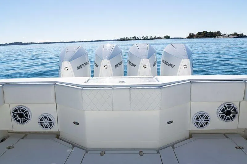 Slide: The Image of 2016 SeaVee 390Z boat with four Mercury engines on calm water. - 36