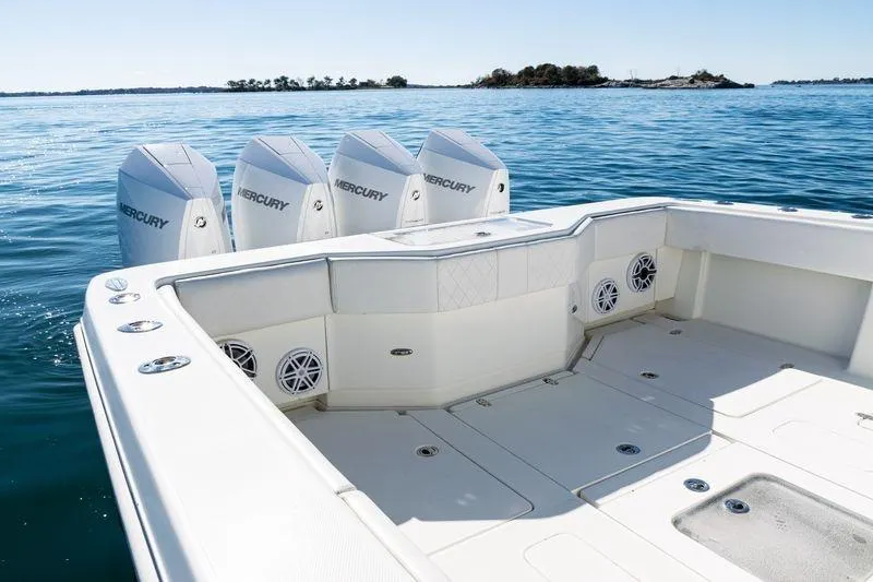 Slide: The Image of 2016 SeaVee 390Z boat with four Mercury engines on calm water. - 42