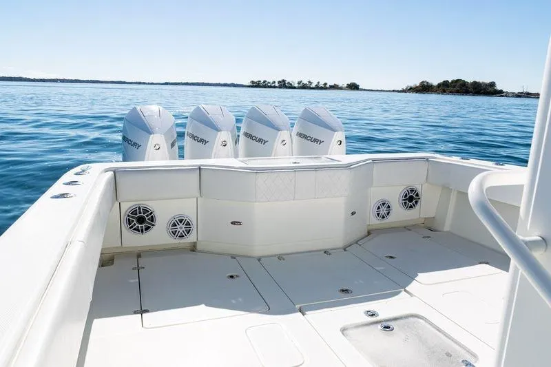 Slide: The Image of 2016 SeaVee 390Z boat with four Mercury engines on calm water. - 44