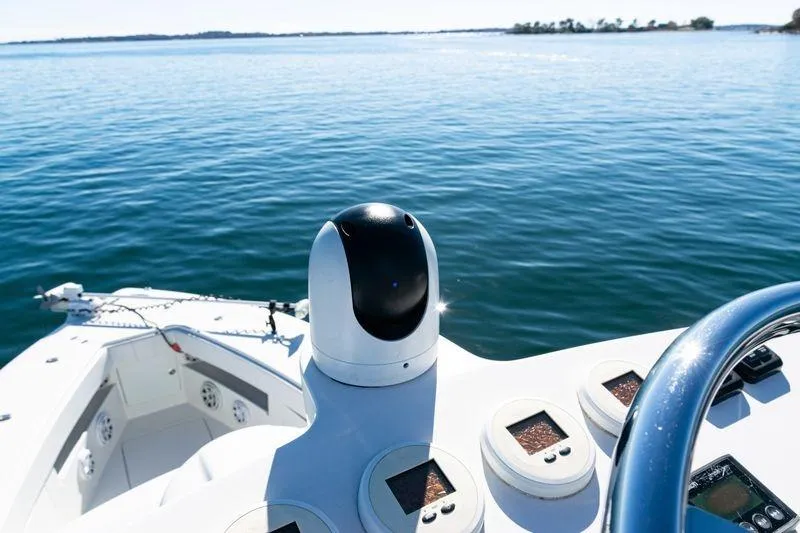 Slide: The Image of 2016 SeaVee 390Z boat dashboard with ocean view and navigation equipment. - 48