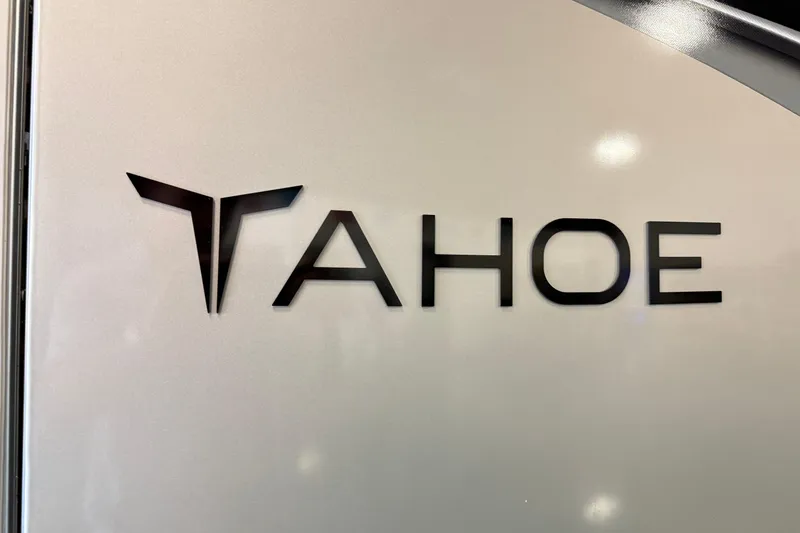 Slide: The Image of 2026 Tahoe Pontoon LTZ Entertainer logo on sleek metallic surface. - 12