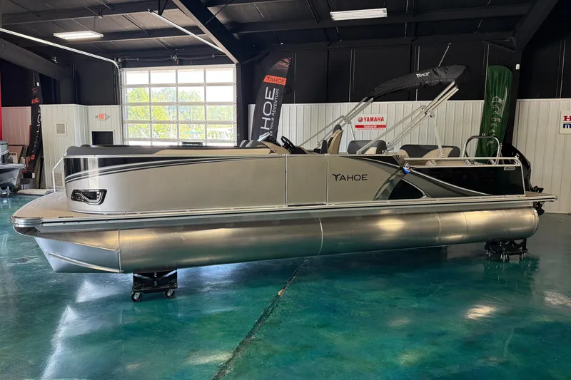 Slide: The Image of 2026 Tahoe Pontoon LTZ Entertainer in showroom, sleek design, modern features. - 13