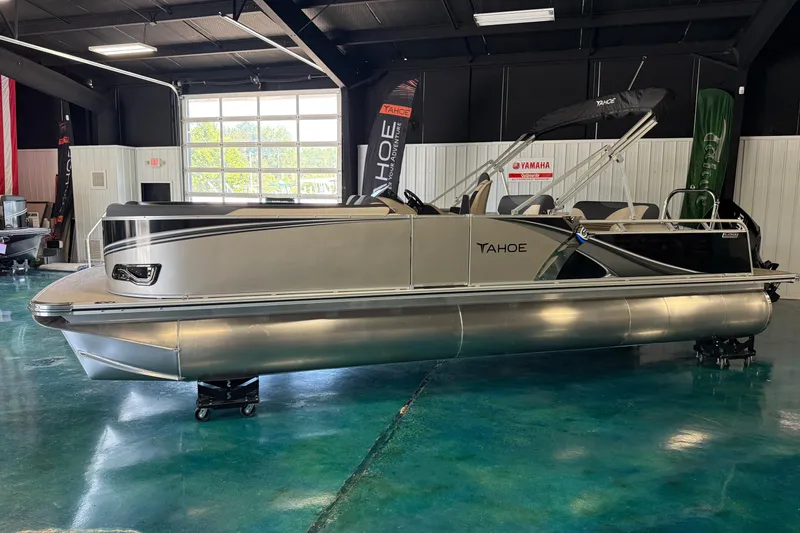 Slide: The Image of 2026 Tahoe Pontoon LTZ Entertainer in showroom, sleek design, modern features. - 14