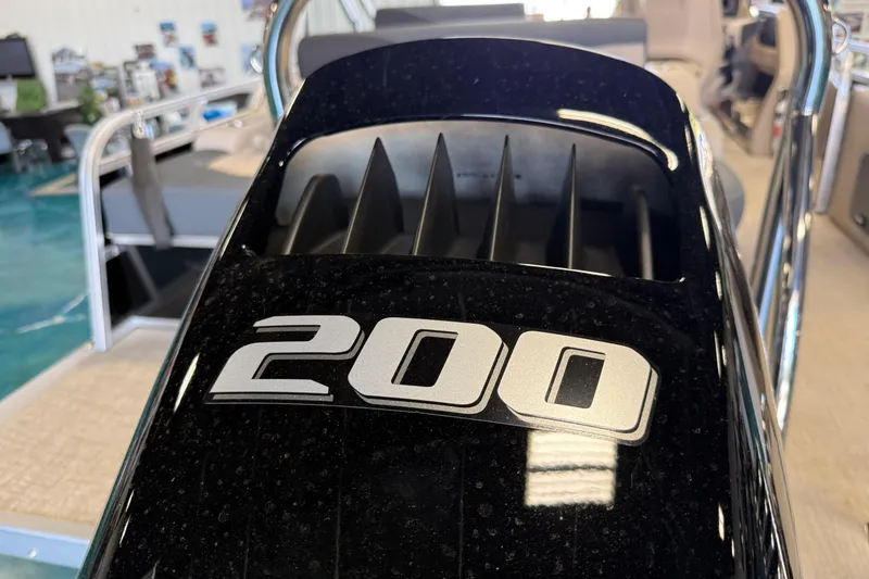 Slide: The Image of Close-up of 2026 Tahoe Pontoon LTZ Entertainer engine with "200" label. - 16